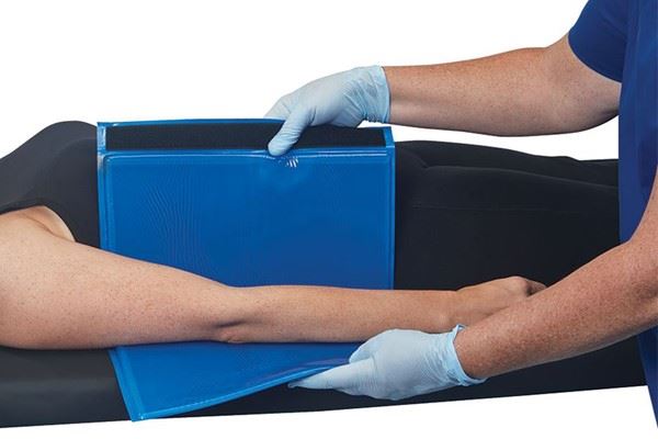 nurse putting AliBlue Gel ulnar forearm protector on patient