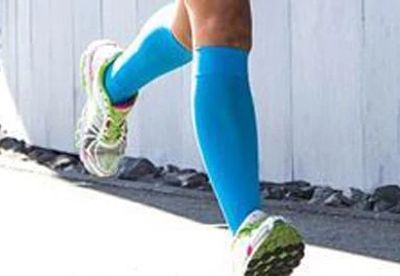 person wearing compression socks while running