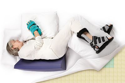 woman lying down with patient positioners