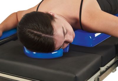 patient lying on operating table with patient positioners