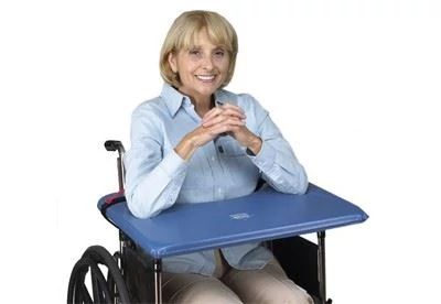 woman in wheelchair using wheelchair tray