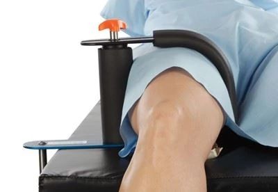 patient on operating table with arthroscopic leg holder