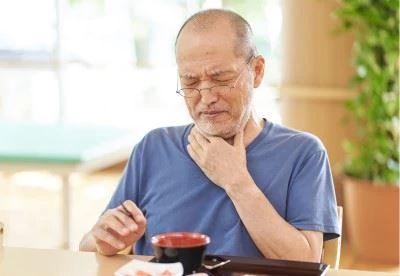 man holding his throat