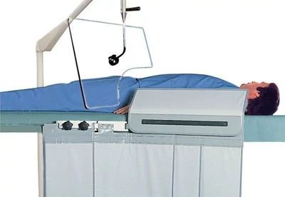 patient on table with radiation shield