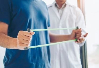 person doing exercise with exercise band