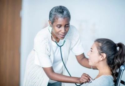 nurse checking heart rate of patient