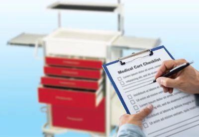 person checking list of medical cart inspection