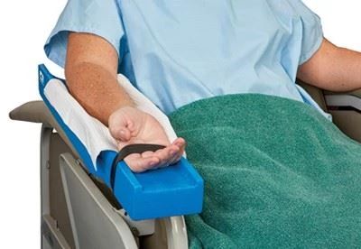 person using dialysis arm board