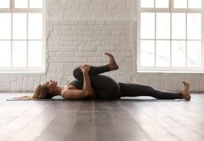 woman stretching her knee