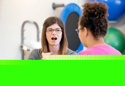 speech therapist showing patient pronunciation with throat