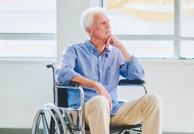 man sitting in wheelchair