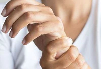 person holding their wrist