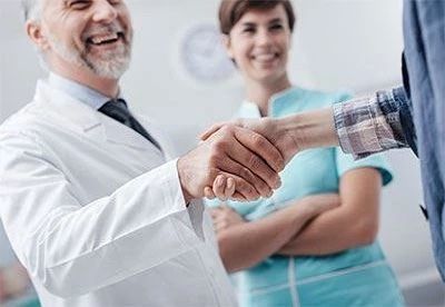 doctor shaking patients hand