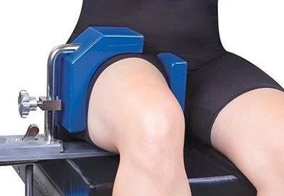 patient on operating table with arthroscopic leg holder