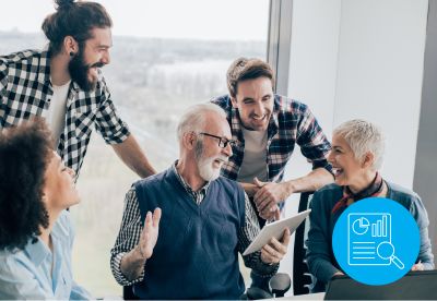 people sitting at table talking and laughing