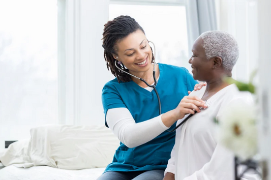 nurse checking patients heat rate
