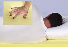 man laying on foam and hand showing foam indent
