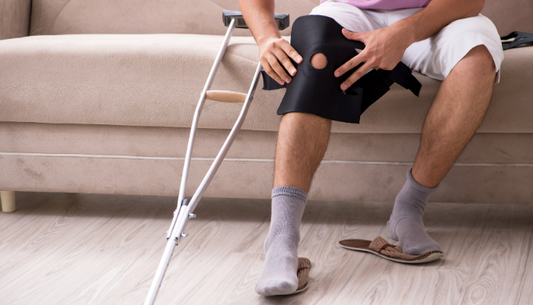 individual putting knee brace on