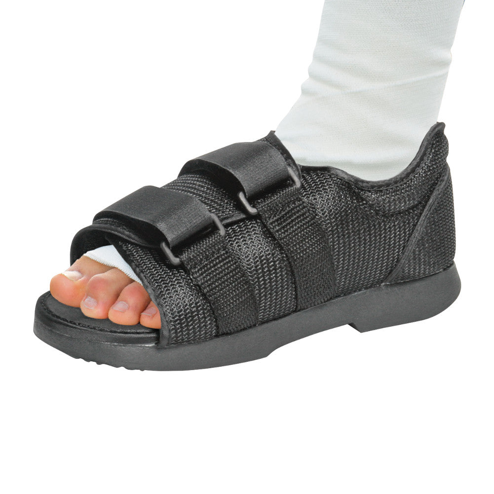 person wearing black darco post-op shoe
