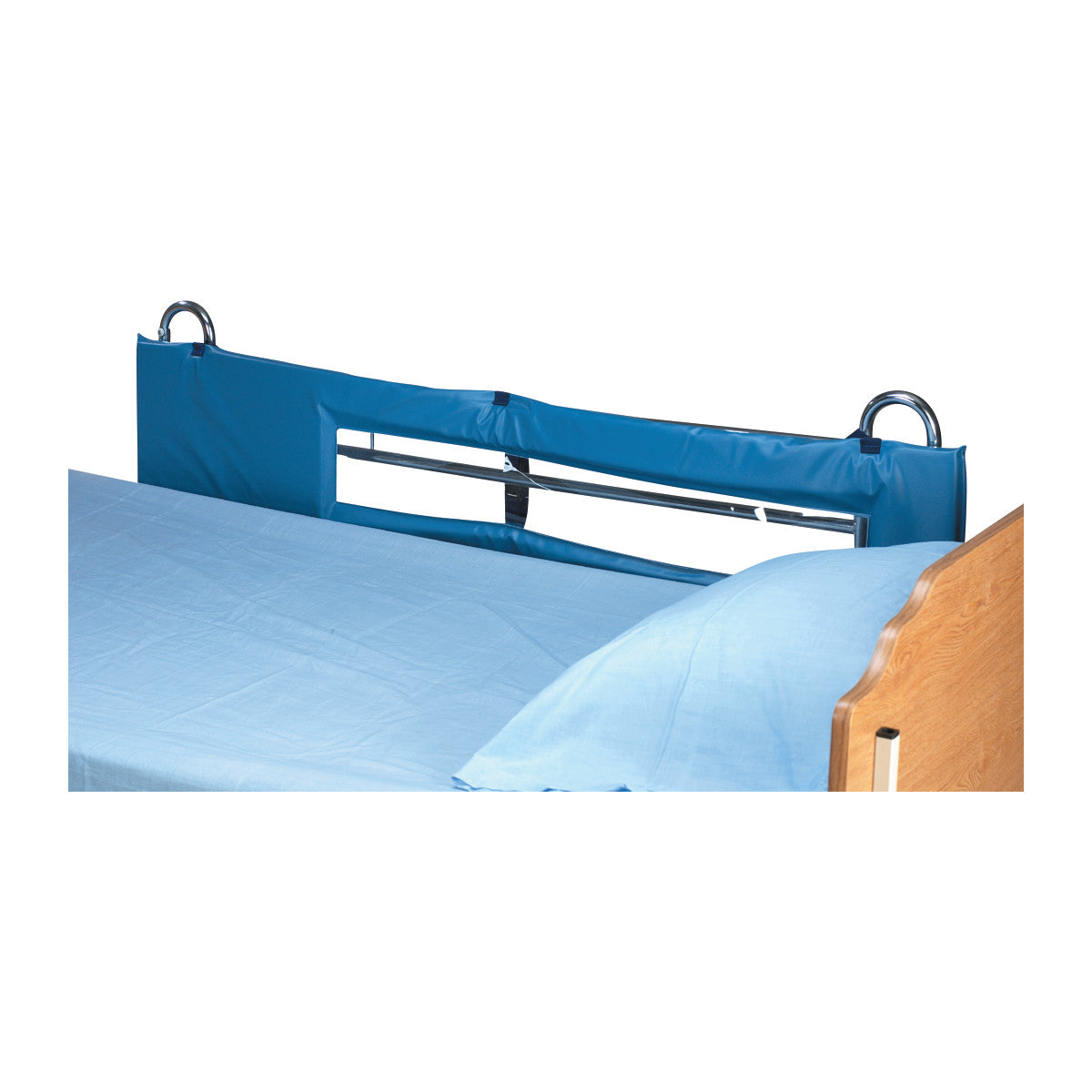 The SkiL-Care Thru-View Vinyl Bed Rail Pad is attached to a hospital bed, featuring a blue padded cover over metal rails.