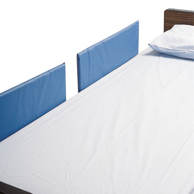 SkiL-Care Split-Rail Vinyl Bed Rail Pad attached to a bed with a white sheet, providing cushion and protection on the side rails.