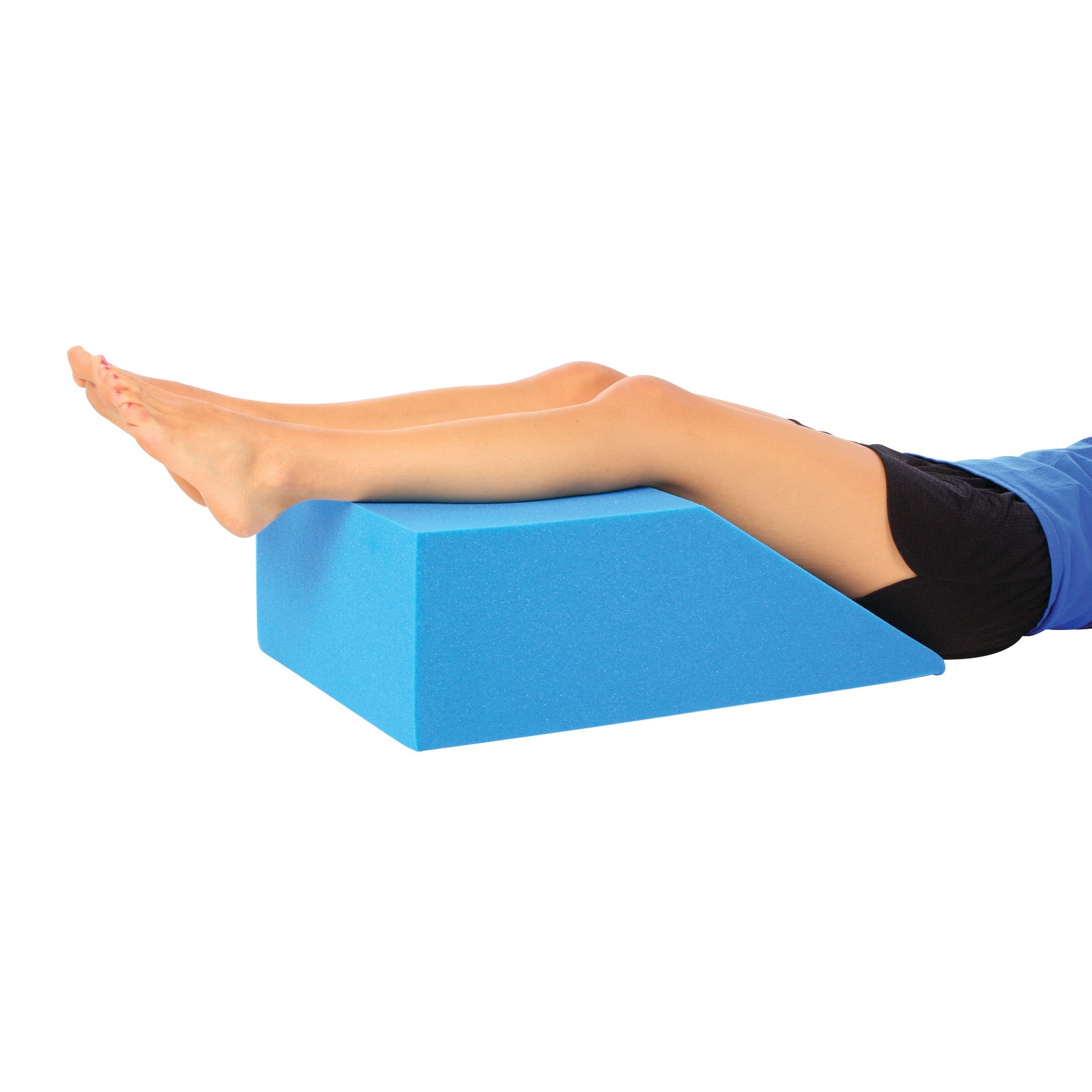 Person using the AliMed Uncovered Foam Bed Wedge to support their legs while lying down. The wedge is blue and trapezoidal.
