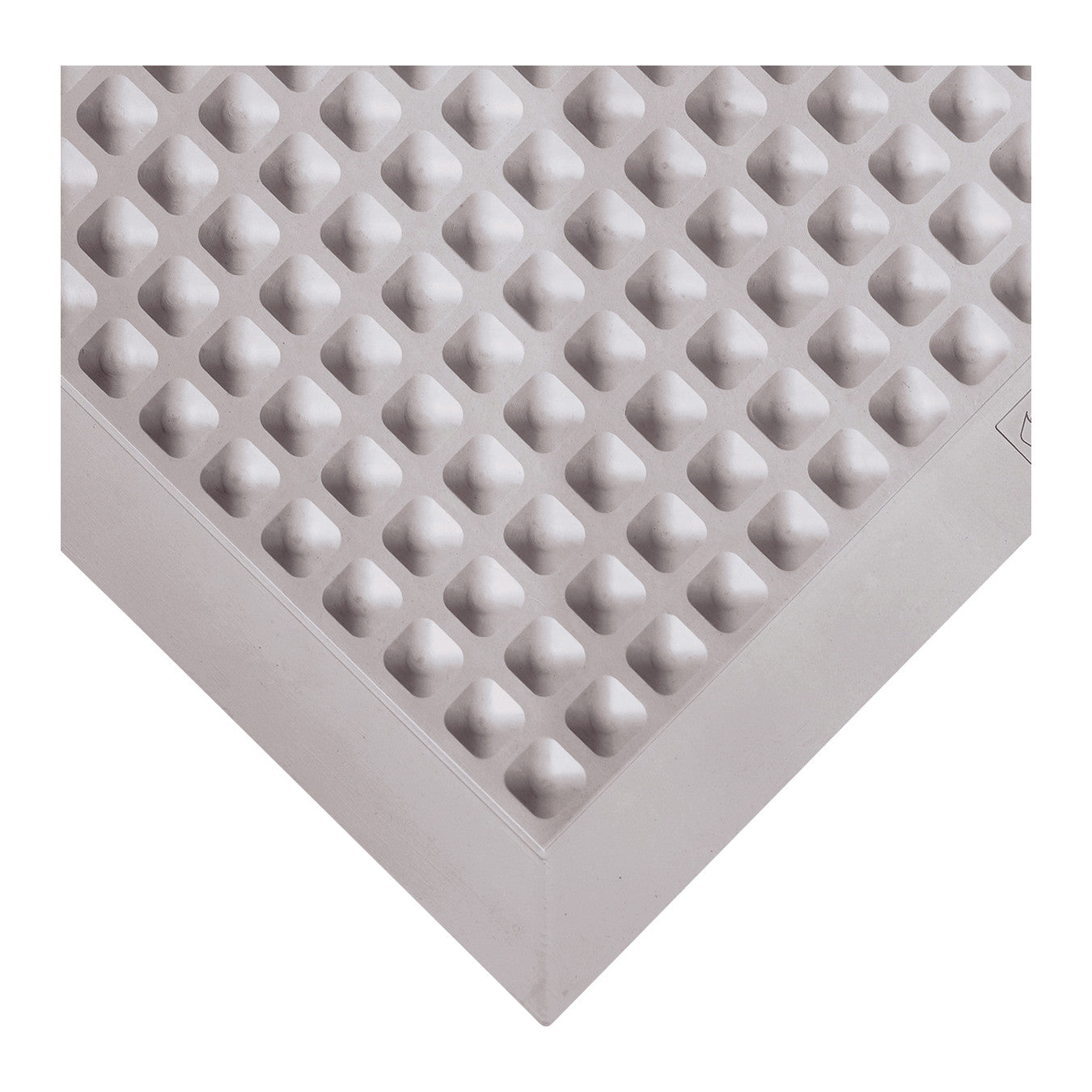 Close-up of the Wearwell Autoclavable Anti-Fatigue Mat, showing a textured, raised diamond pattern in a corner view.