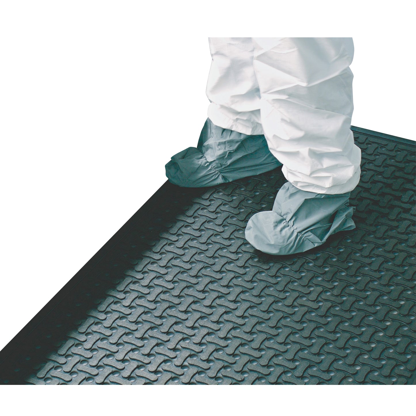 A person wearing protective clothing stands on a Comfort Flow Anti-Fatigue Mat with a textured surface and rounded edges.