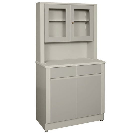 UMF Wide Treatment Cabinet in gray with a countertop, two upper glass doors, and two lower solid doors with a pair of drawers above.