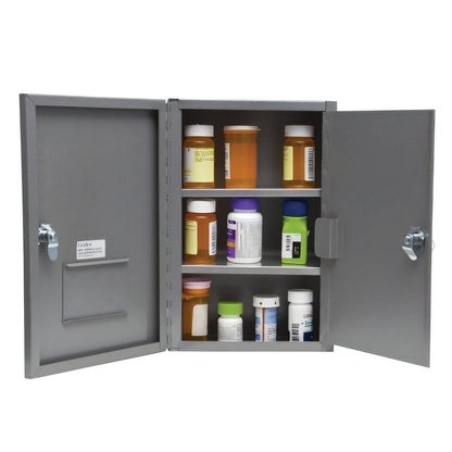 The Graham-Field Narcotics Safe is open, displaying various bottles of medication on three shelves inside a metal cabinet.