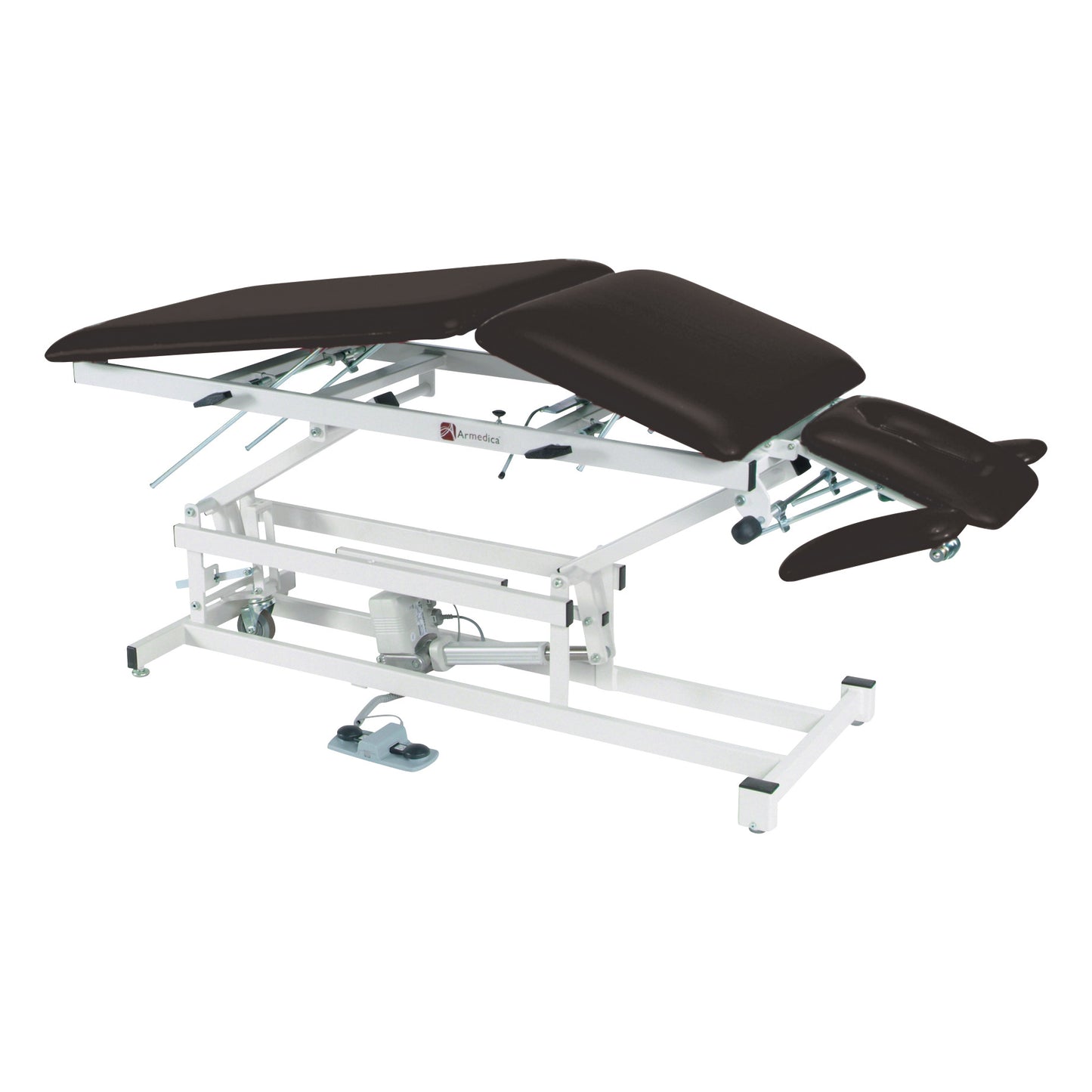 Armedica AM-500 Treatment Table with adjustable, padded sections and a white metal frame, featuring a foot pedal control.