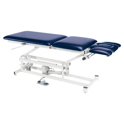 The Armedica AM-550 Treatment Table features a blue cushioned surface, adjustable sections, and a sturdy white metal frame.