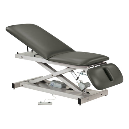 Clinton Power 500 Open Base Table features adjustable positions with a padded surface and a control remote for height adjustments.