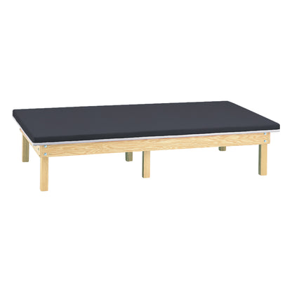 Clinton Bariatric Upholstered Mat Platform with a black cushioned top on a light wood frame with sturdy legs.