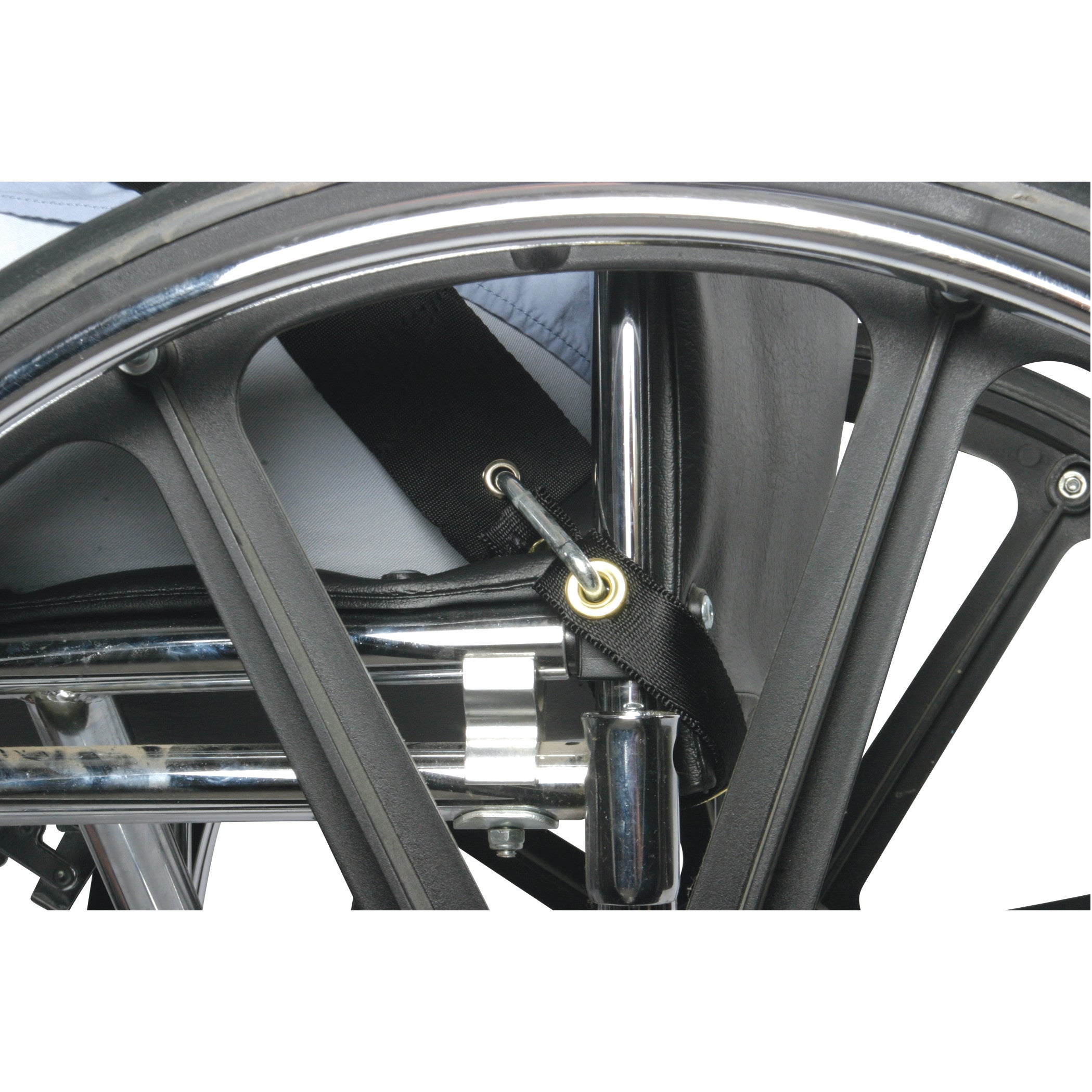 A close-up of a wheelchair's wheel and frame, showing the AliMed UniLoop Seatbelt Attachment secured to the frame with a hook.