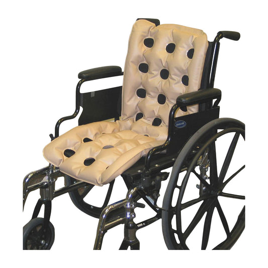 A wheelchair equipped with an EHOB WAFFLE Multi-Care Pad, featuring a beige cushion with black dots.