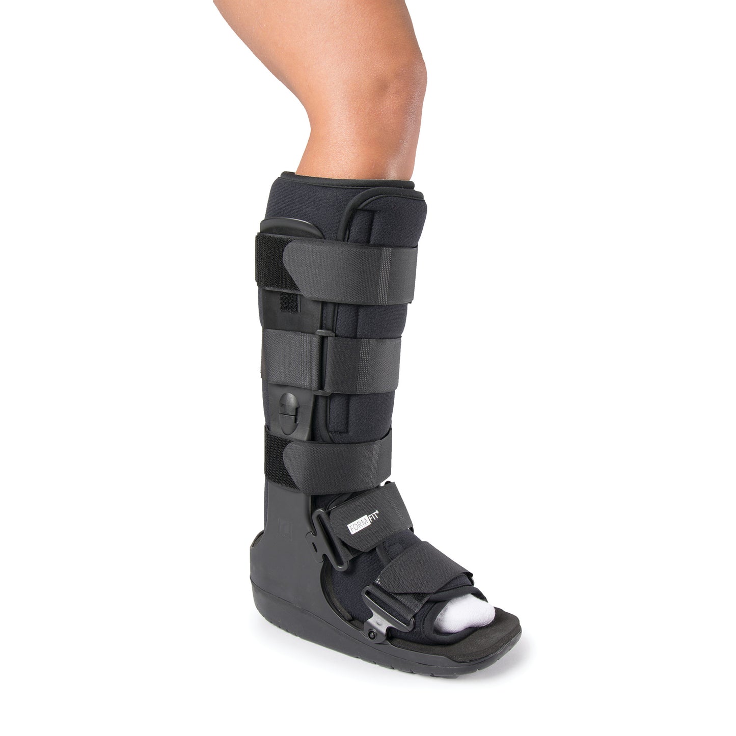 A leg wearing an Ossur Formfit High-Top Walker boot, featuring adjustable straps and a rigid sole for foot and ankle support.