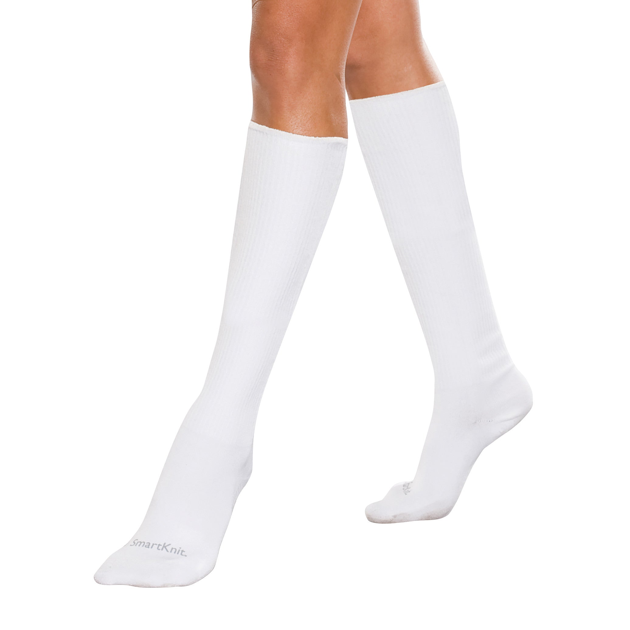 A person wearing SmartKnit Seamless Over-the-Calf Socks in white, extending up to just below the knees on a plain background.