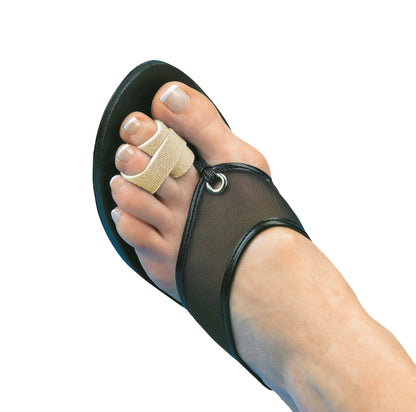 A foot in a black sandal wearing a 3pp Toe Loop to separate and align the first two toes with beige fabric straps.