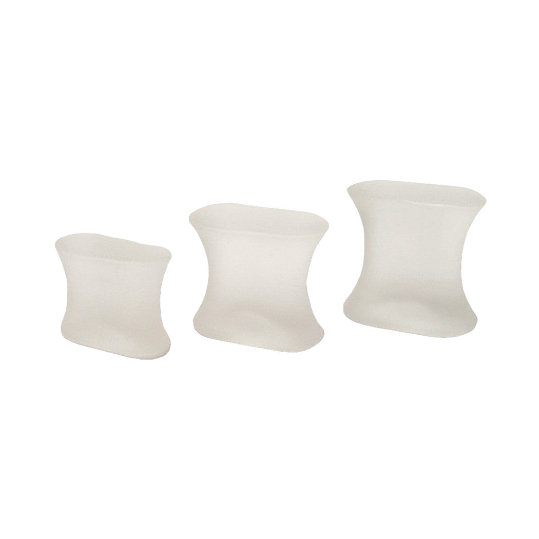 Three Silipos Gel Toe Spreaders of varying sizes, made of a translucent, soft material, are arranged in a row.
