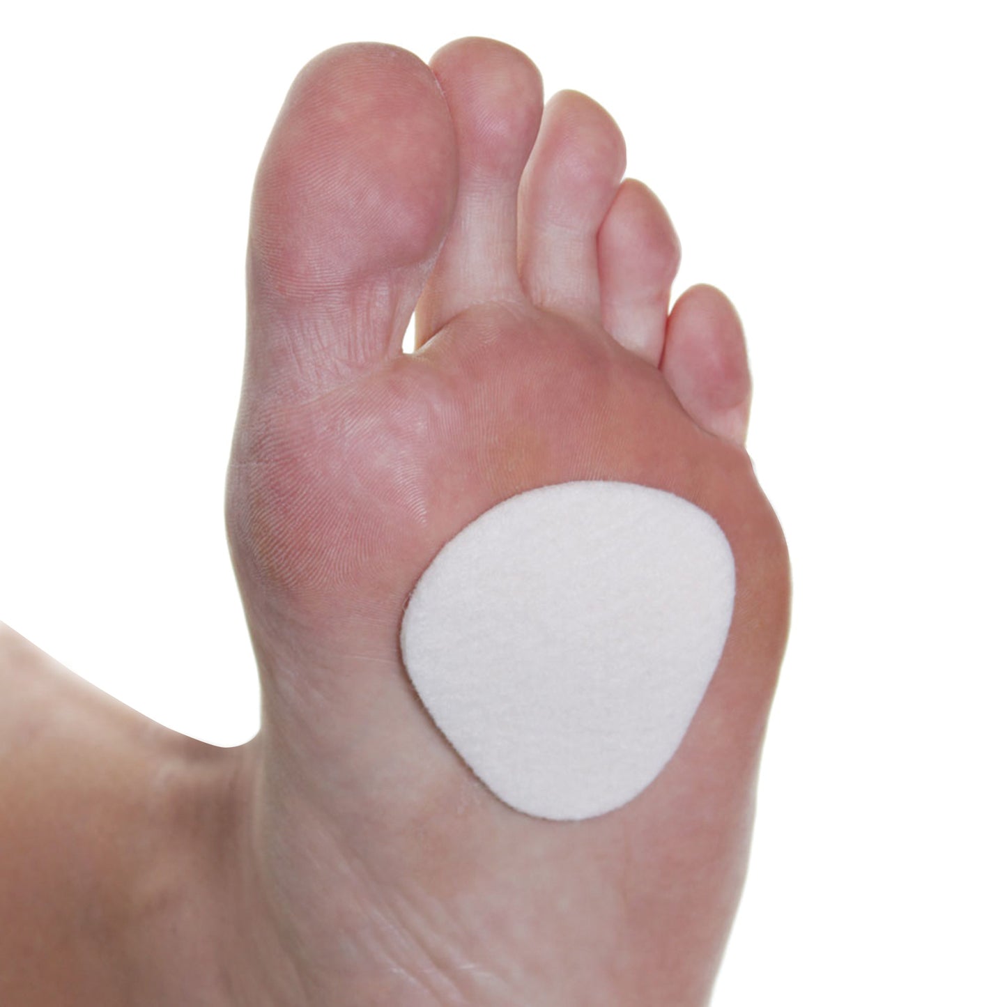 Close-up of a foot with a Felt Met Pad applied to the ball of the foot. The pad is oval, white, and provides cushioning.