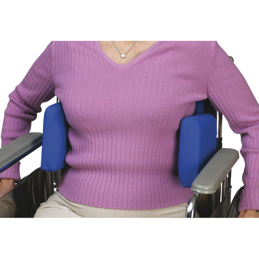 A person seated in a wheelchair using SkiL-Care Adjustable Lateral Support pads for added comfort on both sides.