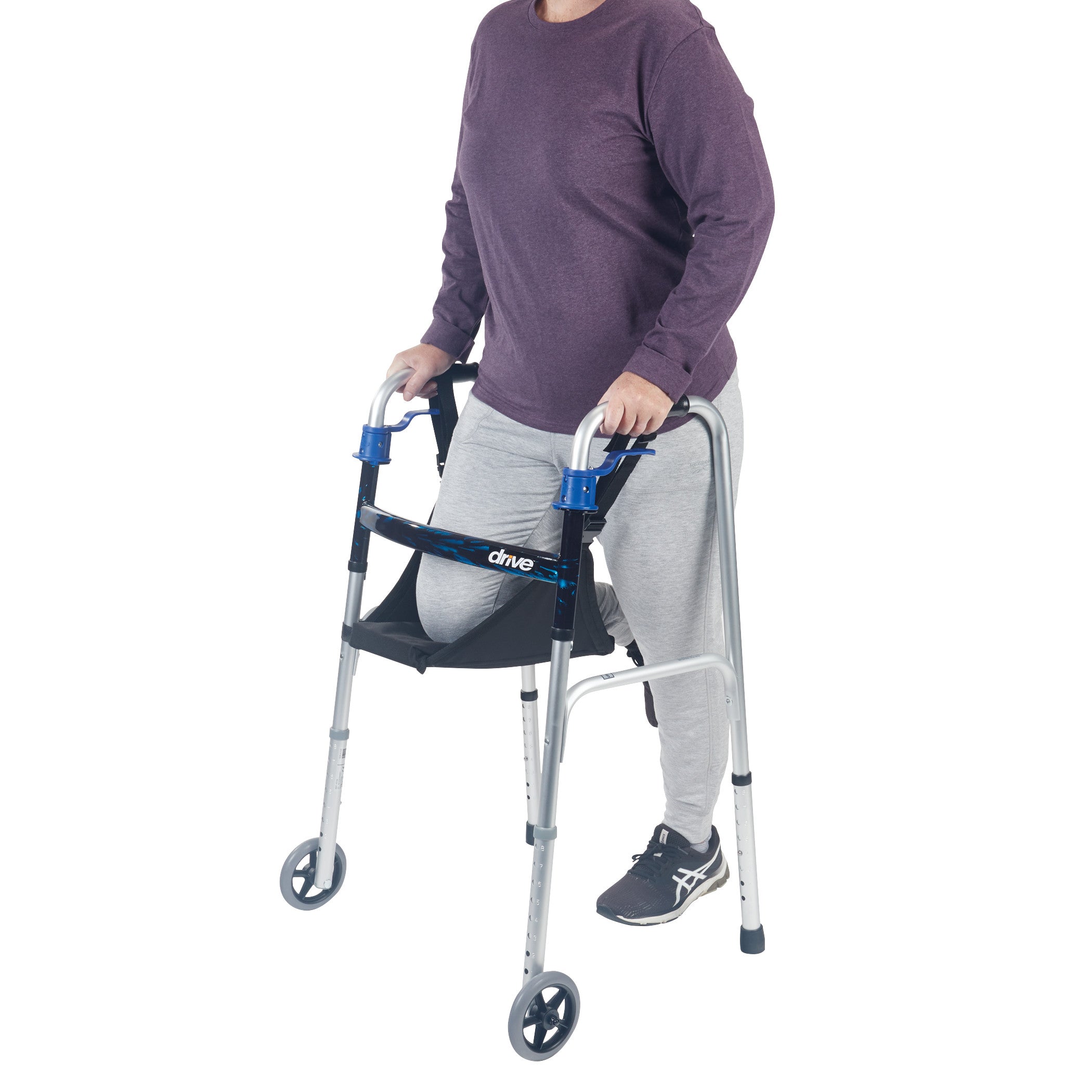 A person uses a walker equipped with the SafetySure The Knee Sling, shown supporting the knee, with two wheels at the front.