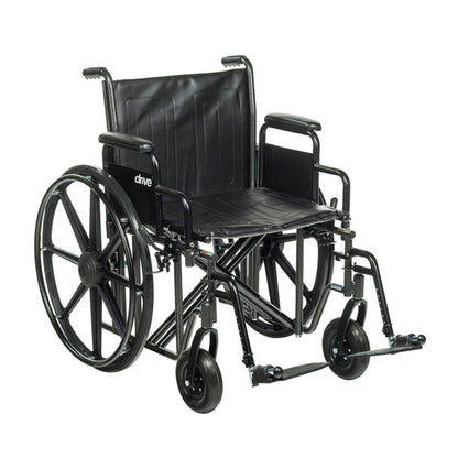Drive Medical Sentra EC Heavy-Duty Wheelchair with Removable Desk Arms and Swing-Away Footrests, featuring large rear wheels.