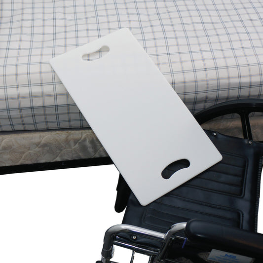 A SafetySure Transfer Board is placed between a plaid-covered bed and a wheelchair, providing a transfer aid for mobility assistance.