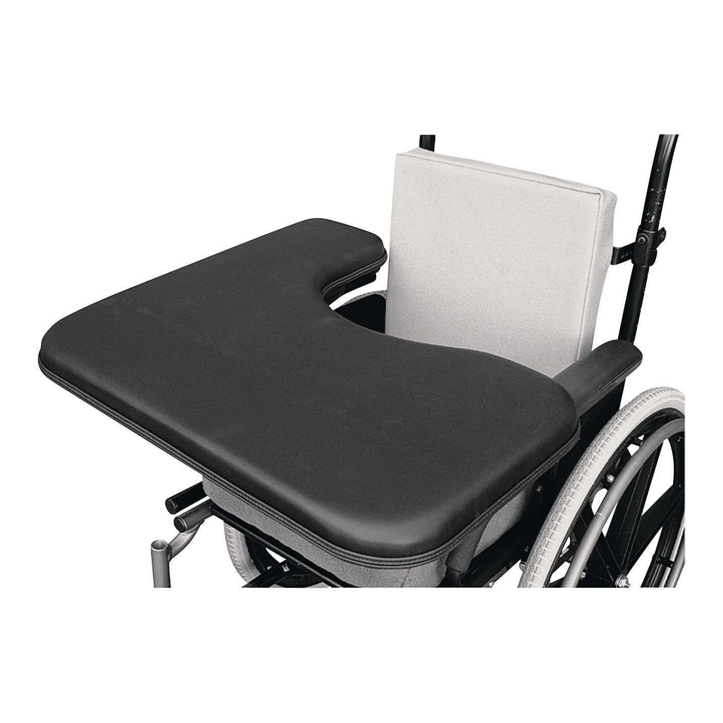 A Therafin Padded Three-Quarter Tray is attached to a wheelchair. It features a U-shaped cutout and cushioned black surface.