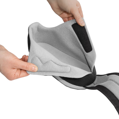Hands adjust the DARCO AllRound Shoe, showing its soft interior lining and hook-and-loop fastener for support and comfort.