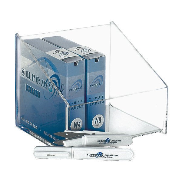 A Suremark Marker Box Holder with several blue label boxes and white marking pens displayed inside a clear acrylic holder.