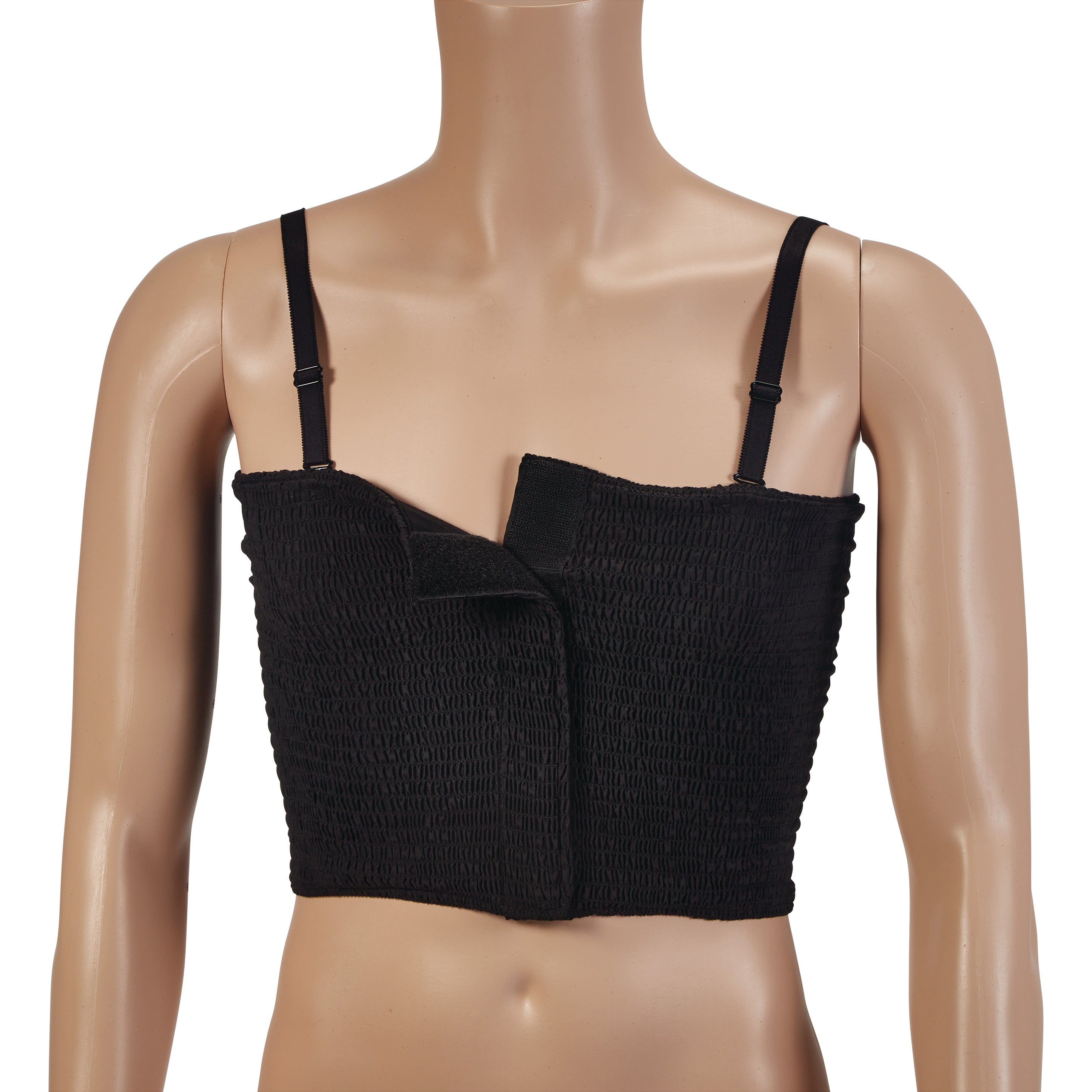 A mannequin wears an Expand-A-Band Lined Breast Binder in black with adjustable straps and a hook and loop closure on the front.