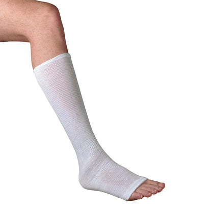 A leg wearing a Compressogrip Tubular Elastic Bandage, which is white and covers from the knee to the toes, leaving toes exposed.
